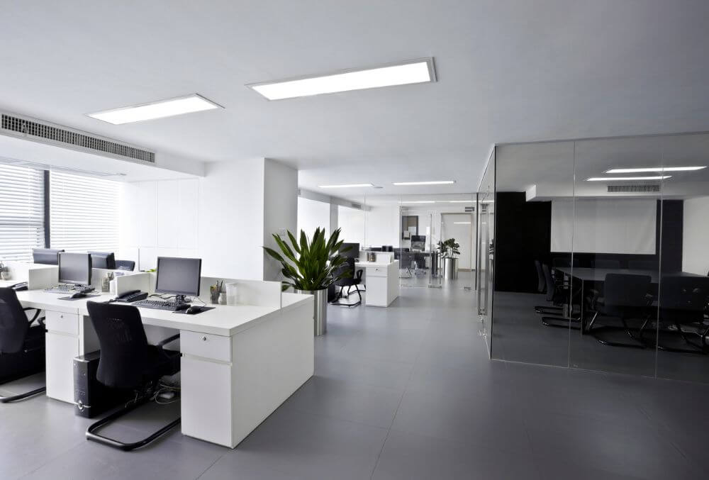 Modern office tables and chairs arranged in a workspace