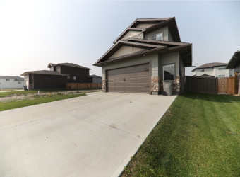 two-storey house concrete driveway