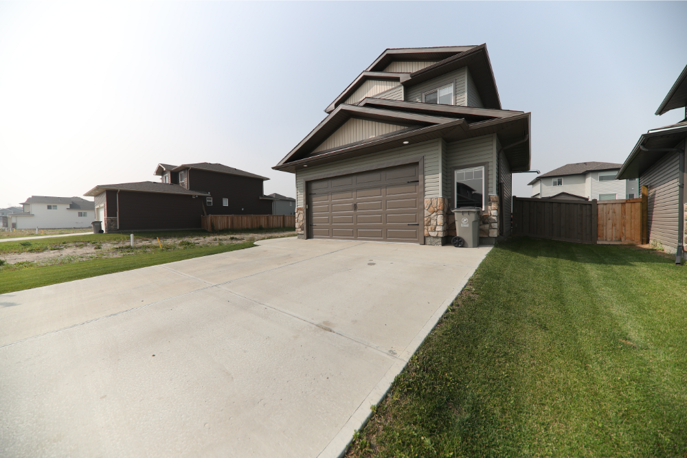 two-storey house concrete driveway