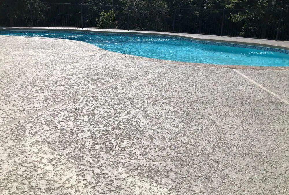 spray knockdown coating on a pool deck