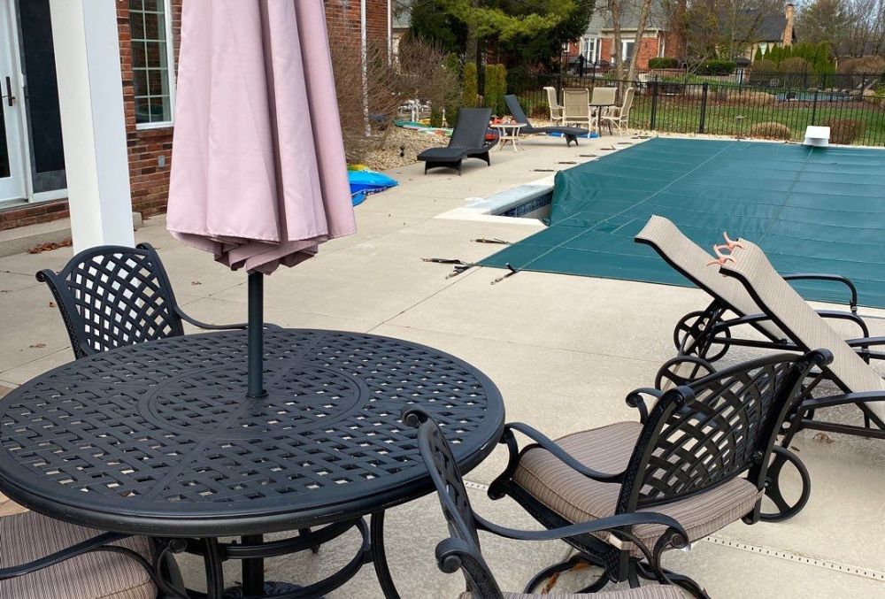 Spray-textured concrete patio surface near pool area.